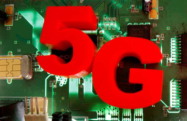 3d printed objects representing 5G are put on a motherboard in this picture illustration