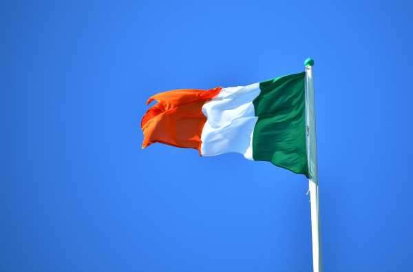 National flag of Ireland flies above the President's residence, ahead of the arrival of Pope Francis, in Dublin