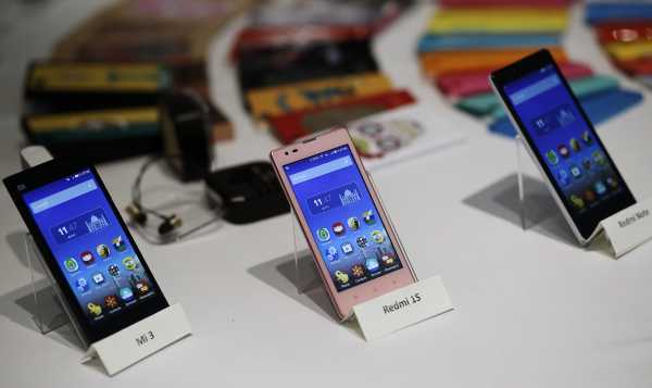 Three models of China's Xiaomi Mi phones are pictured during their launch in New Delhi