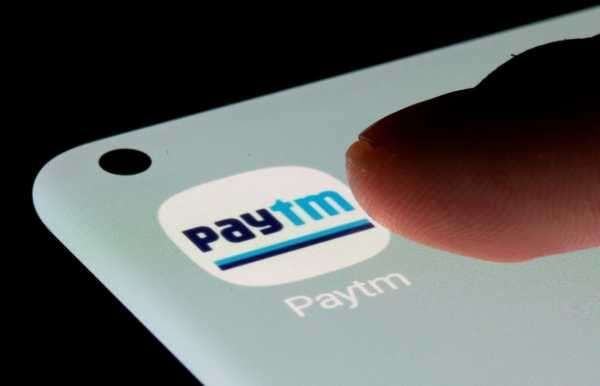 Paytm app is seen on a smartphone in this illustration