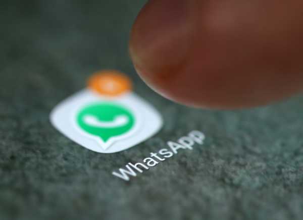 The WhatsApp app logo is seen on a smartphone in this illustration