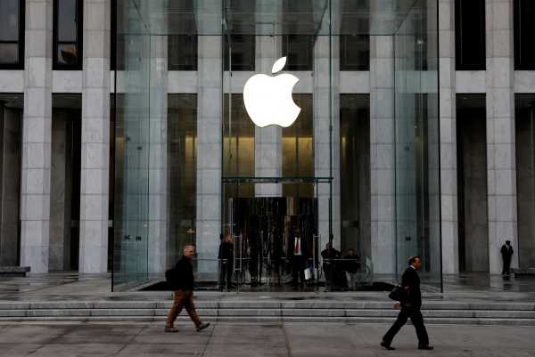 The Apple Inc. logo is seen hanging at the entrance to the Apple store on 5th Avenue in New York