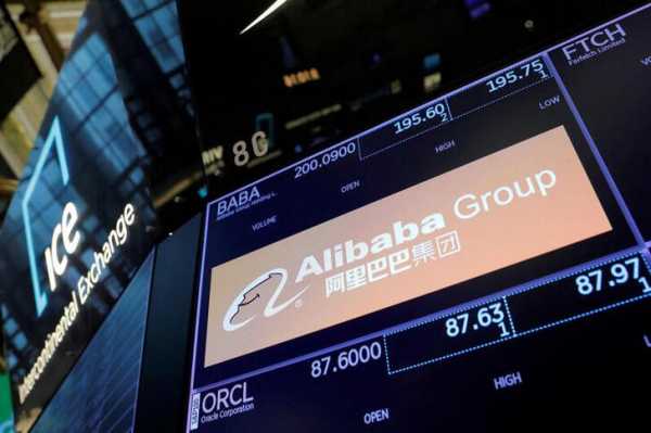 FILE PHOTO: The logo for Alibaba Group is seen on the trading floor at the New York Stock Exchange (NYSE) in Manhattan, New York City