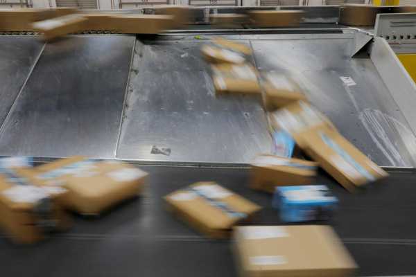 Amazon packages are transported by conveyor belts inside of an Amazon fulfillment center on Cyber Monday in Robbinsville, New Jersey