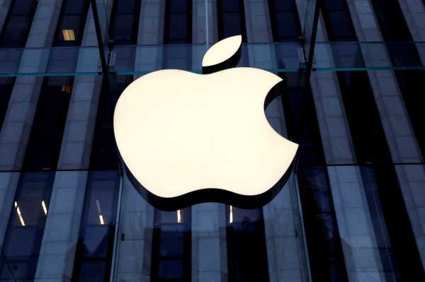 The Apple Inc logo is seen hanging at the entrance to the Apple store on 5th Avenue in New York